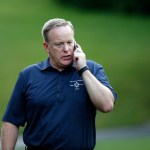 White House Press Secretary Sean Spicer talks on a phone during the Congressional Picnic on the South Lawn of the White House, Thursday, June 22, 2017, in Washington. (AP Photo/Alex Brandon)