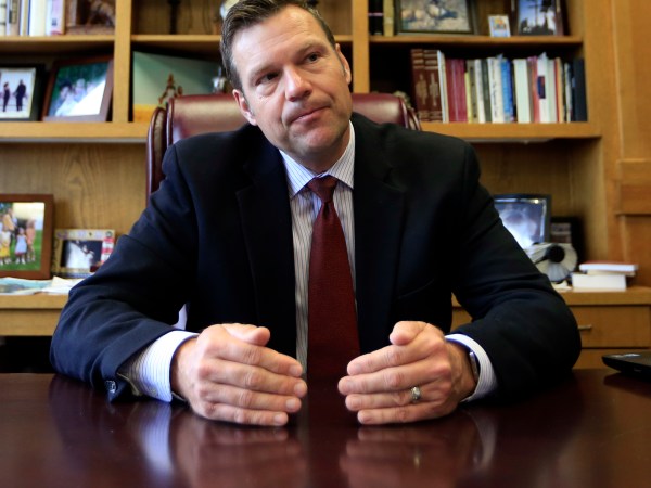 Secretary of State Kris Kobach talks with a reporter in his office in Topeka, Kan., Wednesday, May 17, 2017. (AP Photo/Orlin Wagner)