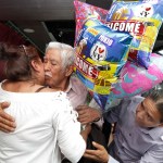 Luis Mendes Chanes, center, is reunited with his daughter Marta Mendez and her husband Luis Flores, of Queens, N.Y., aboard the Bateaux New York, in New York,  Wednesday, July 5, 2017. She had not seen him in 24 years. (AP Photo/Richard Drew)