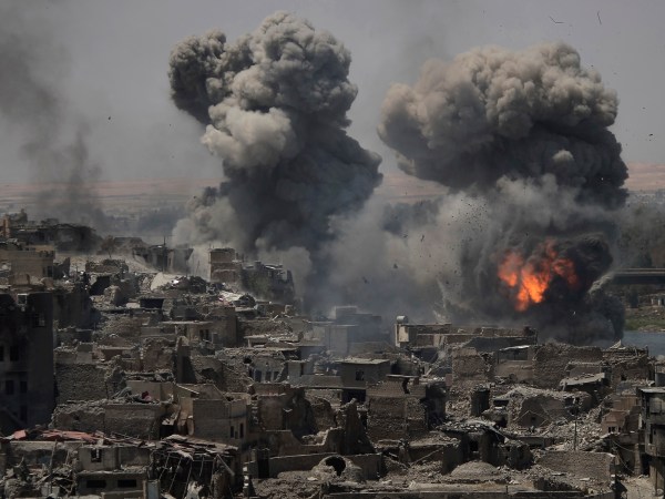 *** Alternative crop os XFD101 *** Airstrikes continue to target Islamic State positions on the edge of the Old City a day after Iraq’s prime minister declared "total victory" in Mosul, Iraq, Tuesday, July 11, 2017. (AP Photo/Felipe Dana)
