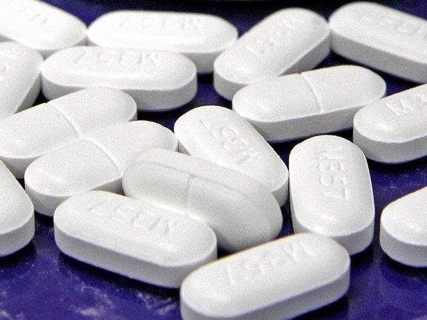 FILE - This Feb. 19, 2013 file photo shows hydrocodone-acetaminophen pills, also known as Vicodin, arranged for a photo at a pharmacy in Montpelier, Vt. A government report released Thursday, July 6, 2017, finds opioid prescription rates have been falling in recent years overall, but rising in more than 1 in 5 U.S. counties. (AP Photo/Toby Talbot, File)