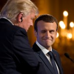 French President Emmanuel Macron winks at President Donald Trump during a joint news conference at the Elysee Palace in Paris, Thursday, July 13, 2017. (AP Photo/Carolyn Kaster)