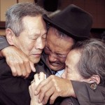 In this Oct. 22, 2015, file photo, North Korean Son Kwon Geun, center, weeps with his South Korean relatives as he bids farewell after the Separated Family Reunion Meeting at Diamond Mountain resort in North Korea. South Korea’s Red Cross said on Monday, July 17, 2017, it wants separate talks at the border village on Aug. 1 to discuss family reunions. (Korea Pool Photo via AP, File) KOREA OUT