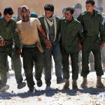 Syrian Internal Security Forces dance during their graduation ceremony, at Ain Issa desert base, in Raqqa province, northeast Syria, Thursday, July 20, 2017. Some 250 residents of Syria's Raqqa province are the latest batch to graduate from a brief U.S-training course that is preparing an internal security force to hold and secure areas as they are captured from Islamic State militants.(AP Photo/Hussein Malla)