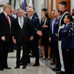 President Donald Trump and Vice President Mike Pence walk out with Defense Secretary Jim Mattis, center, to begin greeting military personnel during their visit to the Pentagon, Thursday, July 20, 2017. (AP Photo/Pablo Martinez Monsivais)