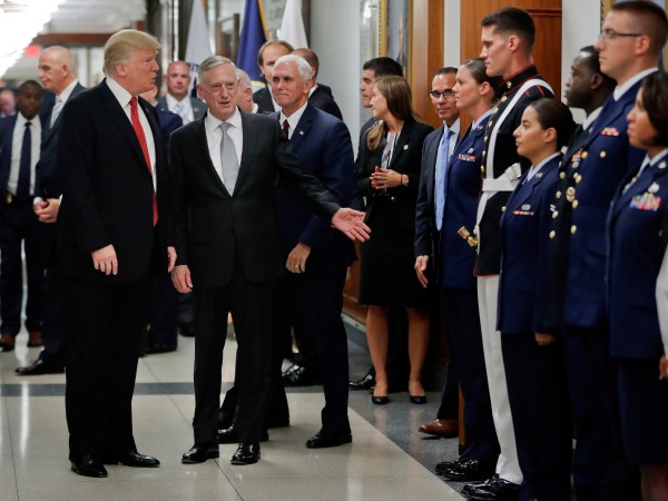 President Donald Trump and Vice President Mike Pence walk out with Defense Secretary Jim Mattis, center, to begin greeting military personnel during their visit to the Pentagon, Thursday, July 20, 2017. (AP Photo/Pablo Martinez Monsivais)