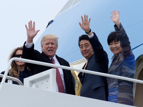 President Donald Trump and Japanese Prime Minister Shinzo Abe wave from the top of the steps of Air Force One at Andrews Air Force Base in Md., Friday, Feb. 10, 2017. Trump is hosting Abe at his estate Mar-a-Lago in Palm Beach, Fla., for the weekend. (AP Photo/Susan Walsh)Akie Abe