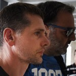 A Russian man is escorted by police officers as he  arrives at a courthouse at the northern Greek city of Thessaloniki, on Wednesday, July 26, 2017. Greek authorities say they have arrested a Russian man wanted in the United States on suspicion of masterminding a money laundering operation involving at least $4 billion through bitcoin transactions. (AP Photo/Giannis Papanikos)