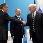 U.S. President Donald Trump, right, greets Russian Foreign Minister Sergey Lavrov, left, prior his talks with Russian President Vladimir Putin, center, during the G20 summit in Hamburg Germany, Friday July 7, 2017. (Mikhail Klimentyev, Kremlin Pool Photo via AP)