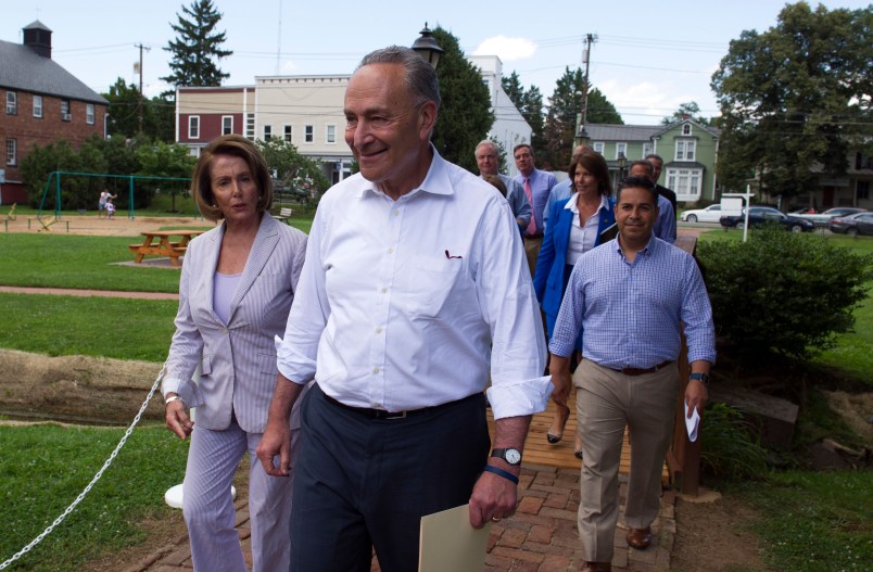 Senate Minority Leader Chuck Schumer of N.Y. and House Minority Leader Nancy Pelosi of Calif. lead Congressional Democrats to a news conference to unveil their new agenda, Monday, July 24, 2017, in Berryville, Va. House and Senate Democrats are offering a retooled message and populist agenda, promising to working Americans "someone has your back."  (AP Photo/Cliff Owen)