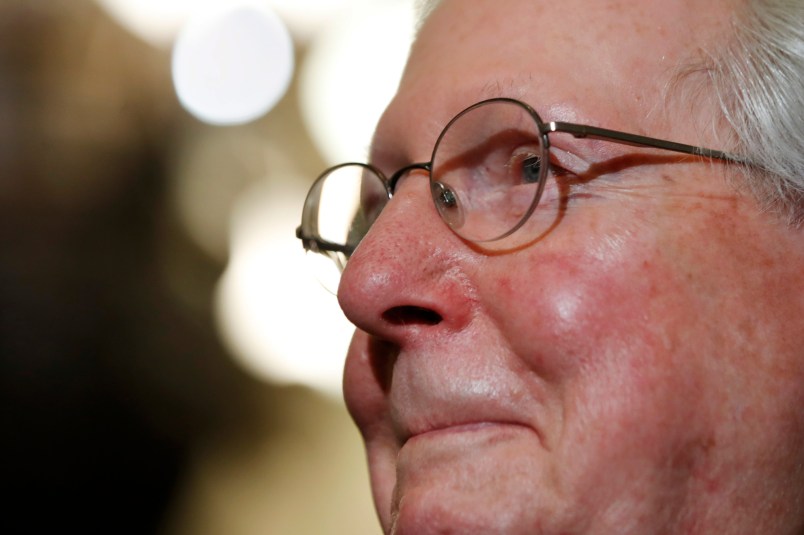 Senate Majority Leader Mitch McConnell of Ky., smiles as he talks to reporters on Capitol Hill in Washington, Tuesday, July 25, 2017, after Vice President Mike Pence broke a 50-50 tie to start debating Republican legislation to tear down much of the Obama health care law. (AP Photo/Jacquelyn Martin)