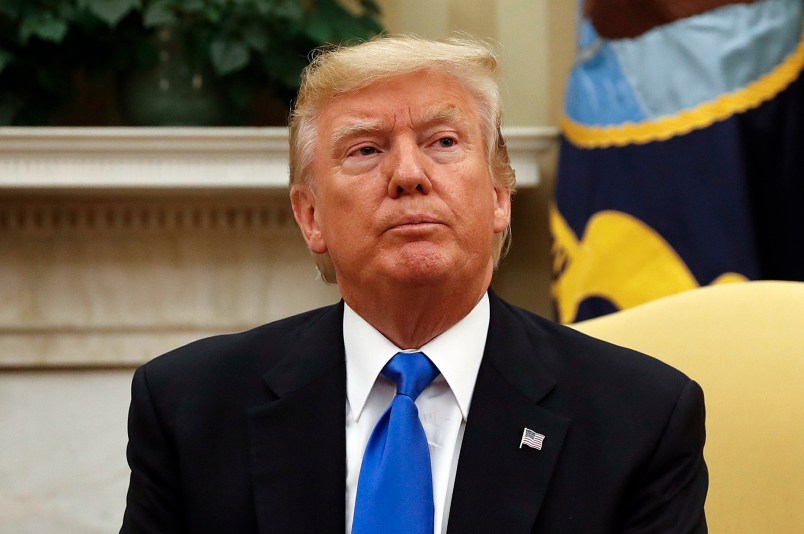 President Donald Trump looks at members of the media extra the Oval Office of the White House in Washington, during his meeting with Lebanese Prime Minister Saad Hariri, Tuesday, 25, 2017. (AP Photo/Pablo Martinez Monsivais)