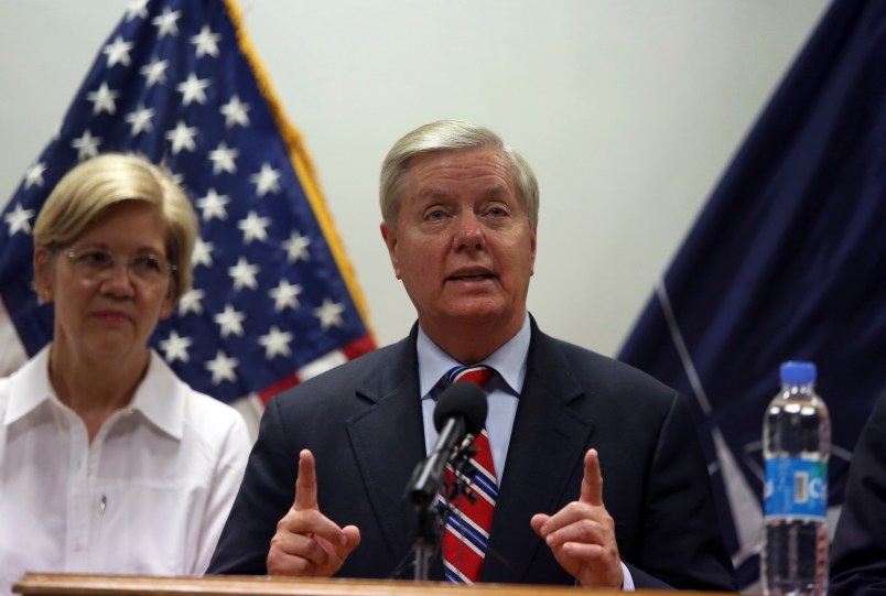 U.S. Senator Lindsey Graham right, speaks during a press conference at Resolute Support headquarters in Kabul, Afghanistan, Tuesday, July 4, 2017, (AP Photo/Rahmat Gul)