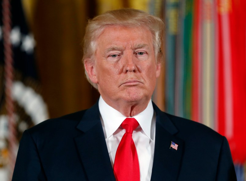 President Donald Trump stands as he waits to bestow the nation's highest military honor, the Medal of Honor to retired Army medic James McCloughan during a ceremony in the East Room of the White House in Washington, Monday, July 31, 2017. McCloughan is credited with saving the lives of members of his platoon nearly 50 years ago in the Battle of Nui Yon Hill in Vietnam. (AP Photo/Pablo Martinez Monsivais)
