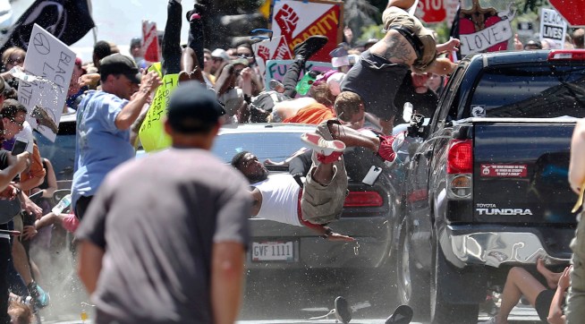A vehicle plows into a group of protesters marching along 4th Street NE at the Downtown Mall in Charlottesville on the day of the Unite the Right rally on Saturday, August 12, 2017. Photo/Ryan M. Kelly/The Daily Progress