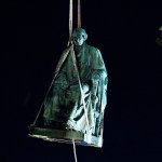 Workers lift with a crane the monument dedicated to U.S. Supreme Court Chief Justice Roger Brooke Taney, after was remove from the outside Maryland State House, in Annapolis, Md., early Friday, Aug. 18, 2017. Maryland workers hauled several monuments away, days after a white nationalist rally in Charlottesville, Virginia, turned deadly. ( AP Photo/Jose Luis Magana)