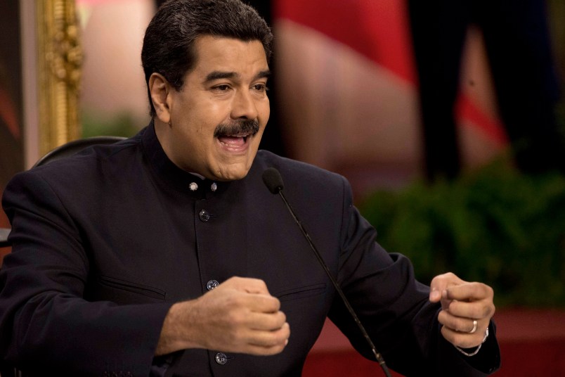 Venezuela's President Nicolas Maduro speaks at a news conference with International press in Caracas, Venezuela, Tuesday, Aug. 22, 2017. Maduro spoke about the next regional elections in the country and the bad relations with the Government of the United State. (AP Photo/Ariana Cubillos)