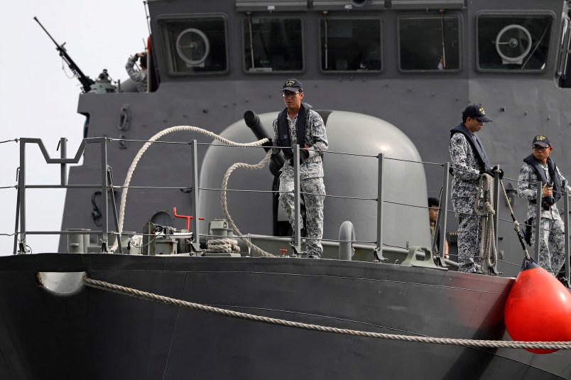 Sailors on the Republic of Singapore Navy's RSS Brave, casts off from a berth at Tuas naval base on a search and rescue mission for USS John S. McCain's 10 missing  sailors on Thursday, Aug. 24, 2017 in Singapore. Aircraft and ships from the navies of Singapore, Malaysia, Indonesia and Australia are searching seas east of Singapore where the collision between USS John S. McCain and an oil tanker happened early Monday. (AP Photo/Wong Maye-E)