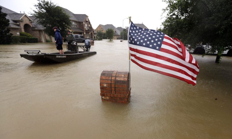 Volunteers use their boat to help evacuate residents as floodwaters from Tropical Storm Harvey rise Monday, Aug. 28, 2017, in Spring, Texas. (AP Photo/David J. Phillip)