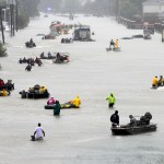 Rescue boats fill a flooded street at flood victims are evacuated as floodwaters from Tropical Storm Harvey rise Monday, Aug. 28, 2017, in Houston. (AP Photo/David J. Phillip)