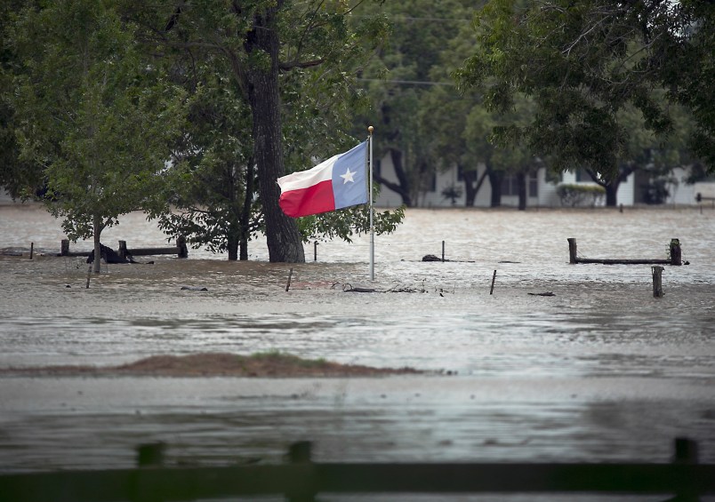 A Texas flag flies in flood waters caused by Hurricane Harvey. La Grange, TX. in Fayette County endured historic flooding when the Colorado River crested over flood stage at more than 53 feet Monday August 28, 2017. City streets and businesses were completely under water and some neighborhoods remain uninhabitable for the foreseeable future.RALPH BARRERA / AMERICAN-STATESMAN