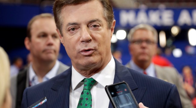 FILE - In this July 17, 2016 file photo, Trump Campaign Chairman Paul Manafort talks to reporters on the floor of the Republican National Convention at Quicken Loans Arena, Sunday, in Cleveland.  Republican Donald Trump announced a shakeup of his campaign leadership Wednesday, the latest sign of tumult in his bid for the White House as his poll numbers slip and only 82 days remain before the election.   (AP Photo/Matt Rourke)