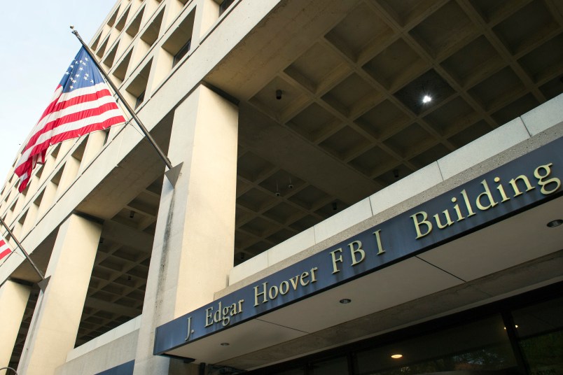 The FBI's J. Edgar Hoover Headquarters, acros the street from the Deparment of Justice, in Washington, Wednesday, Nov. 2, 2016. (AP Photo/Cliff Owen)