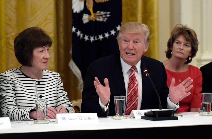 President Donald Trump, center, speaks as he meets with Republican senators on health care in the East Room of the White House in Washington, Tuesday, June 27, 2017. Sen. Susan Collins, R-Maine, left, and Sen. Lisa Murkowski, R-Alaska, right, listen (AP Photo/Susan Walsh)