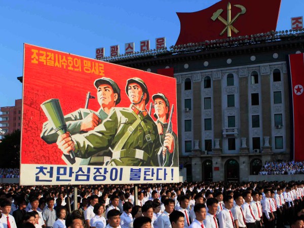 Tens of thousands of North Koreans gathered for a rally at Kim Il Sung Square carrying placards and propaganda slogans as a show of support for their rejection of the United Nations' latest round of sanctions on Wednesday Aug. 9, 2017, in Pyongyang, North Korea. (AP Photo/Jon Chol Jin)