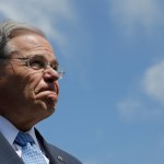 U.S. Sen. Bob Menendez fields questions about his upcoming trial in which he is facing federal corruption charges after completing a flood insurance news conference, Thursday, Aug. 17, 2017, in Union Beach, N.J. (AP Photo/Julio Cortez)