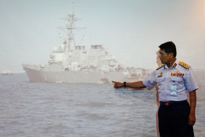 Malaysian Maritime Director Indera Abu Bakar show the damage of USS John S. McCain ship during a press conference in Putrajaya, Malaysia on Monday, Aug. 21, 2017. The U.S. Navy says the USS John S. McCain has arrived at Singapore's naval base with "significant damage" to its hull after a collision early Monday between it and an oil tanker. (AP Photo/Daniel Chan)