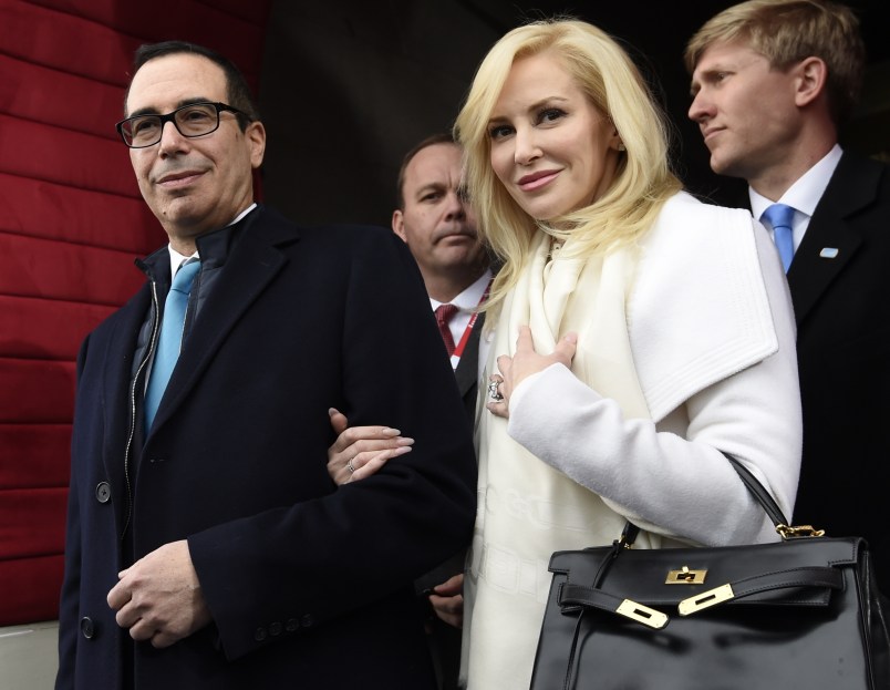 Treasury Secretary-designate Stephen Mnuchin and his fiancee Louise Linton arrive on Capitol Hill in Washington, Friday, Jan. 20, 2017, for the presidential inauguration of Donald Trump. (Saul Loeb/Pool Photo via AP)
