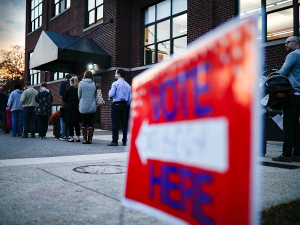 Voter wait in line outside a polling place at the Nativity School on Election Day, Tuesday, Nov. 8, 2016, in Cincinnati. (AP Photo/John Minchillo)