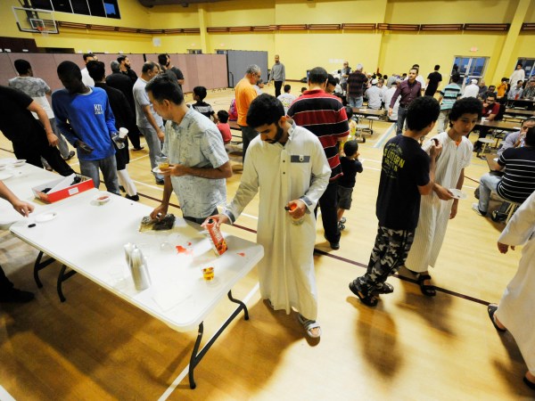 Muslims at Champions Mosque gather for a meal at an Islamic holy day celebration on Thursday, Aug. 31, 2017. Houston’s Muslim community, estimated to be at least 50,000 people, has opened many of its community centers and sent hundreds of volunteers to serve food and deliver donations. (AP Photo/Jay Reeves)