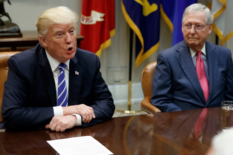 Senate Majority Leader Mitch McConnell, R-Ky., right, looks on as President Donald Trump speaks during a meeting with Congressional leaders and administration officials on tax reform, in the Roosevelt Room of the White House, Tuesday, Sept. 5, 2017, in Washington. (AP Photo/Evan Vucci)