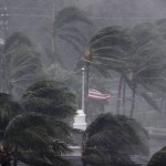 An American flag is torn as Hurricane Irma passes through Naples, Fla., Sunday, Sept. 10, 2017. (AP Photo/David Goldman)