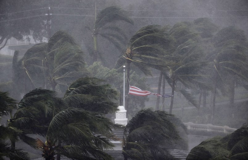 An American flag is torn as Hurricane Irma passes through Naples, Fla., Sunday, Sept. 10, 2017. (AP Photo/David Goldman)