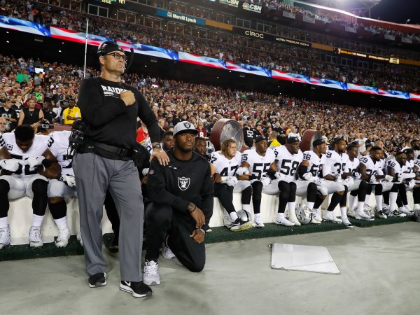 Some members of the Oakland Raiders sits on the bench during the playing of the National Anthem before an NFL football game against the Washington Redskins in Landover, Md., Sunday, Sept. 24, 2017. (AP Photo/Alex Brandon)