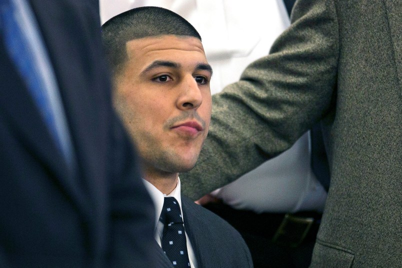FILE - In this April 15, 2015, file photo, former New England Patriots football player Aaron Hernandez listens as the verdict is read finding him guilty in the shooting death of Odin Lloyd, at the Bristol County Superior Court in Fall River, Mass. In court documents filed Monday, May 1, 2017, prosecutors asked a judge to reject a request by attorneys for Hernandez to dismiss his murder conviction because he died before having his appeal heard. Hernandez was found hanged in his prison cell on April 19, 2017.  (Dominick Reuter/Pool Photo via AP, File)