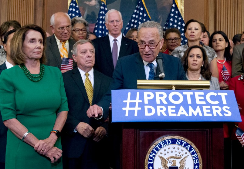 Senate Minority Leader Chuck Schumer of N.Y., accompanied by House Minority Leader Nancy Pelosi of Calif., left, and others members of the House and Senate Democrats, speaks during a news conference on Capitol Hill in Washington, Wednesday, Sept. 6, 2017. House and Senate Democrats gather to call for Congressional Republicans to stand up to President Trump's decision to terminate the Deferred Action for Childhood Arrivals (DACA) initiative by bringing the DREAM Act for a vote on the House and Senate Floor. ( AP Photo/Jose Luis Magana)