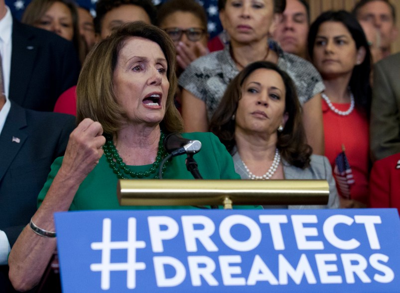 House Minority Leader Nancy Pelosi of Calif. accompanied by members of the House and Senate Democrats, gestures during a news conference on Capitol Hill in Washington, Wednesday, Sept. 6, 2017. House and Senate Democrats gather to call for Congressional Republicans to stand up to President Trump's decision to terminate the Deferred Action for Childhood Arrivals (DACA) initiative by bringing the DREAM Act for a vote on the House and Senate Floor. ( AP Photo/Jose Luis Magana)