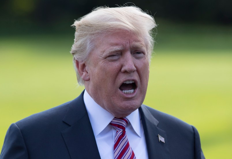 President Donald Trump talks to media as he walks across the South Lawn of the White House in Washington, Friday, Sept. 29, 2017, to Marine One for the short trip to Andrews Air Force Base en route to Bedminster, N.J.. (AP Photo/Carolyn Kaster)