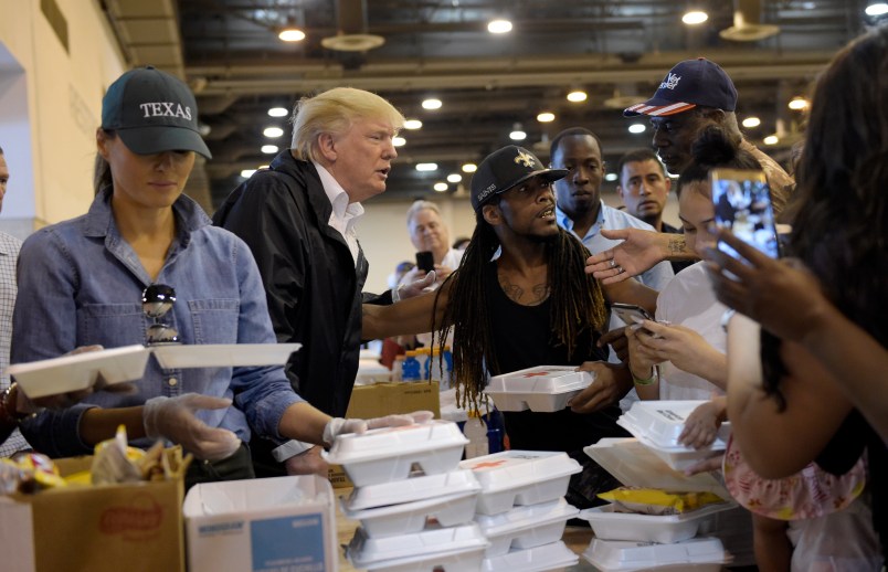 President Donald Trump and Melania Trump pass out food and meet people impacted by Hurricane Harvey during a visit to the NRG Center in Houston, Saturday, Sept. 2, 2017. The Trumps will also make a stop in Lake Charles, La., to meet with people at an emergency operations center. (AP Photo/Susan Walsh)