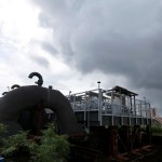 FILE -In this Thursday, Aug. 10, 2017 file photo, rain clouds gather over the 17th Street Canal pumping station in New Orleans.  Flood-weary New Orleans braced Thursday for the weekend arrival of Tropical Storm Nate, forecast to hit the area Sunday morning as a weak hurricane that could further test a city drainage system in which weaknesses were exposed during summer deluges.(AP Photo/Gerald Herbert, File)