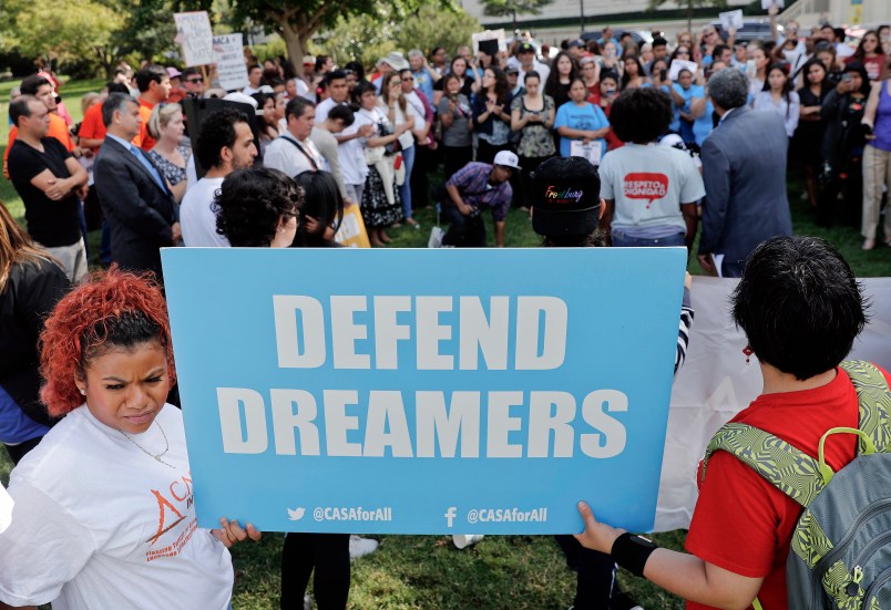 Immigrant rights supporters gather at the U.S. Capitol in Washington, Tuesday, Sept. 26, 2017. The groups and allies are demanding that Congress pass a 'Clean Dream Act' that will prevent the deportation of Dreamers working and studying in the U.S., and reform legalization of those with Temporary Protection Status who came to the U.S. fleeing natural disasters or civil wars. (AP Photo/Pablo Martinez Monsivais)