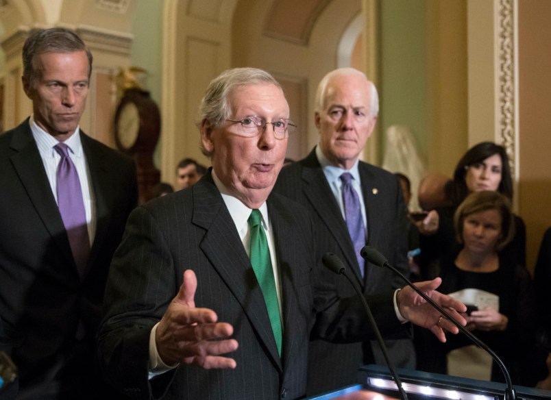 Senate Majority Leader Mitch McConnell, R-Ky., flanked by Sen. John Thune, R-S.D., left, and Majority Whip John Cornyn, R-Texas, announces to reporters that the Senate is moving ahead on a Republican budget plan, a critical step in President Donald Trump and the party's politically imperative drive to cut taxes and simplify the IRS code, at the Capitol in Washington, Tuesday, Oct. 17, 2017.  (AP Photo/J. Scott Applewhite)
