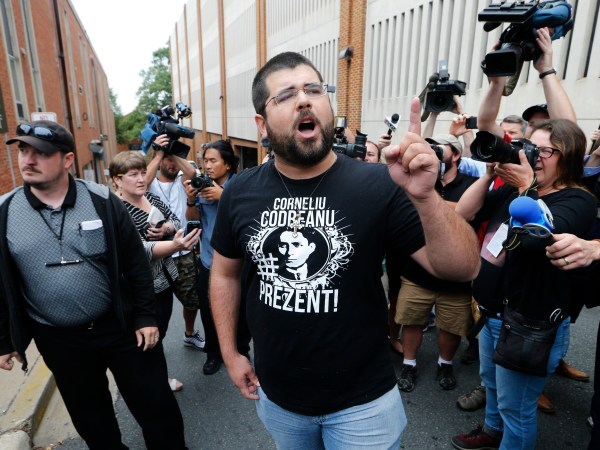 An alt-right supporter, Matthew Heinbach, right, voices his displeasure at the media after a court hearing for James Alex Fields Jr., in front of court in Charlottesville, Va., Monday, Aug. 14, 2017.  (AP Photo/Steve Helber)