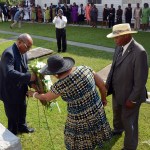 In this Sunday, July 1, 2012, photo, from left, Freddie Meyer, great-great grandson of Robert Smalls, places a wreath in front of Smalls' grave with help from fellow descendant Carolyn Meyer-Little and Edgar Williams, one of the Robert Smalls Association reunion organizers, during the reunion near Tabernacle Baptist Church in Beaufort, S.C. Robert Smalls was an African American slave during and after the Civil War, who freed himself, his crew and their families by commandeering a Confederate transport ship, the CSS Planter, and sailing it to freedom. (AP Photo/The Beaufort Gazette, Sarah Welliver)