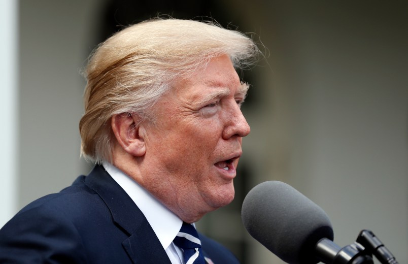 President Donald Trump speaks as he stands next Senate Majority Leader Mitch McConnell of Ky., after their meeting at the White House, Monday, Oct. 16, 2017, in Washington. (AP Photo/Alex Brandon)