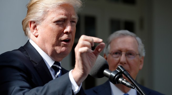 President Donald Trump speaks as he stands next Senate Majority Leader Mitch McConnell of Ky., after their meeting at the White House, Monday, Oct. 16, 2017, in Washington. (AP Photo/Alex Brandon)